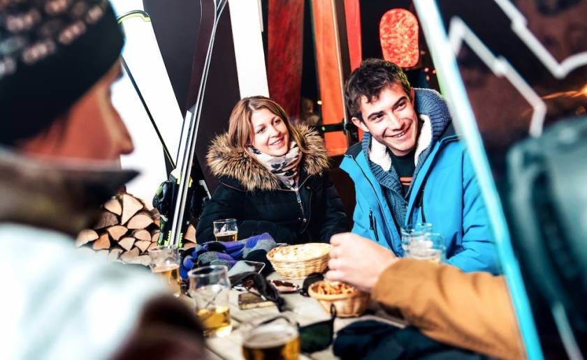 friends enjoying drinks at ski resort